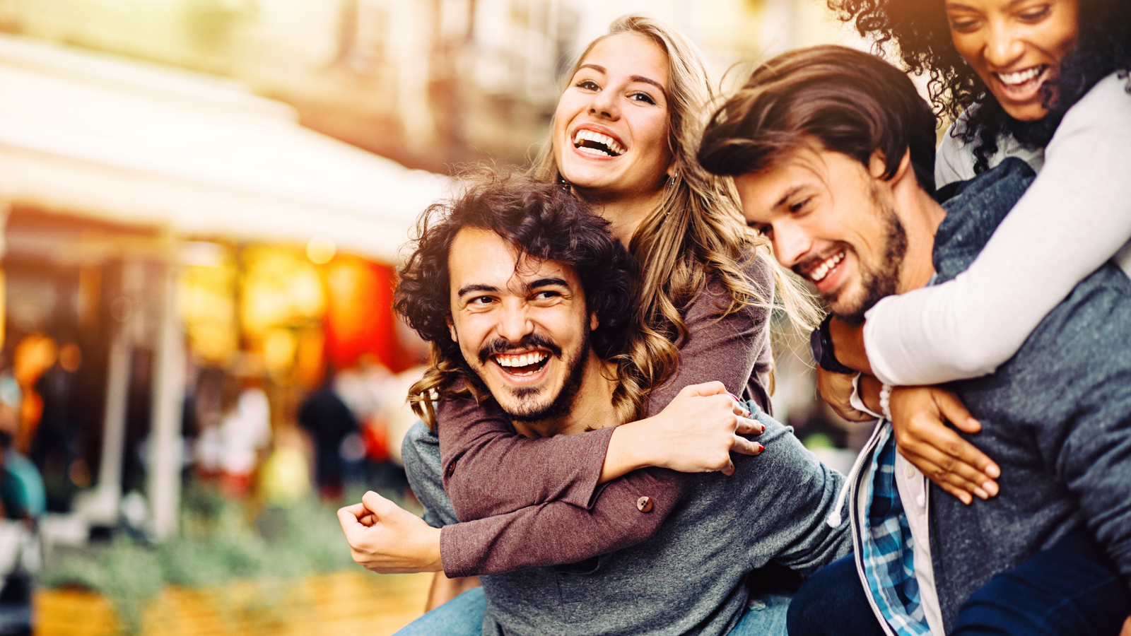 Friends smiling together in a city